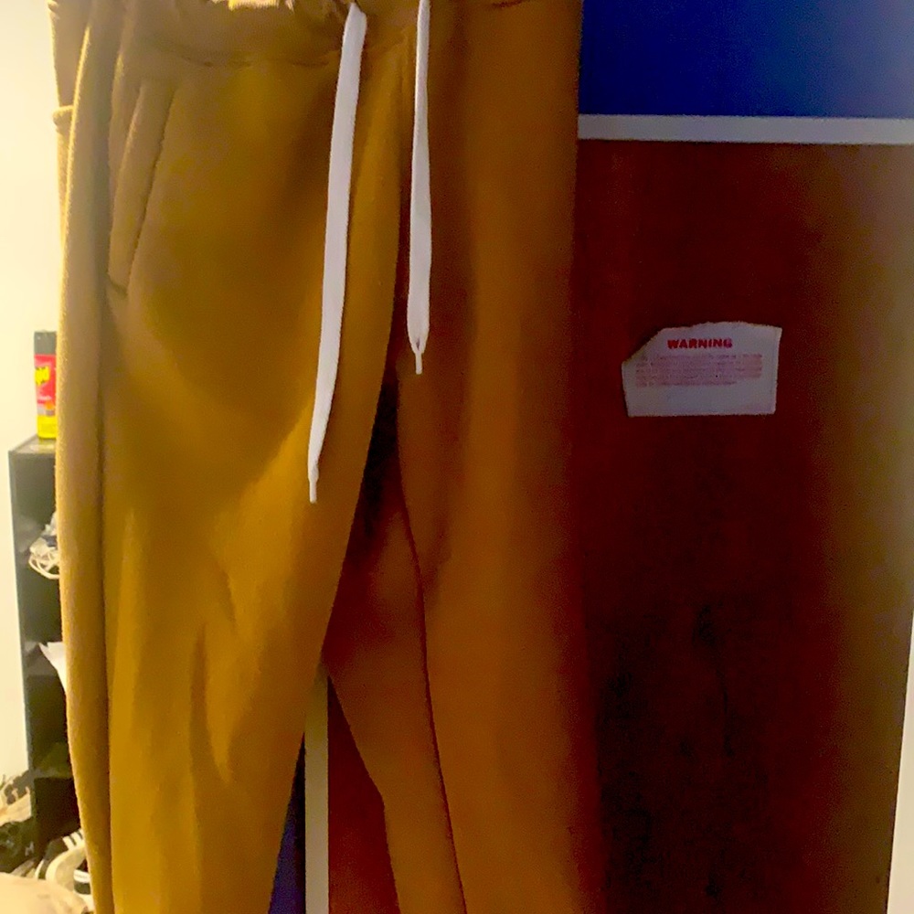A large khaki colored sweatpants, Slightly worn ..